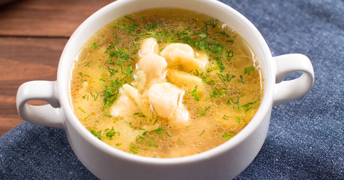 A bowl of chicken gnocchi soup.